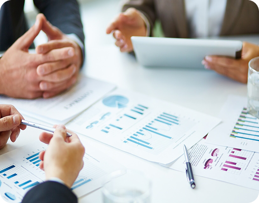 Business meeting with charts and analysis